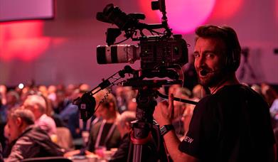Camera man recording an event