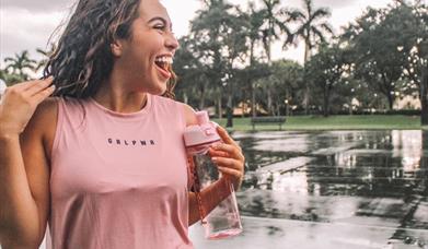 Young woman wearing Victoria's Secret Pink.