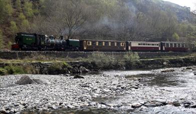 Train on the West Highland Railway, with river in front