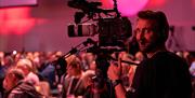 Camera man recording an event